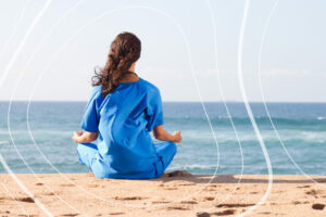 Nurse meditating on the beach